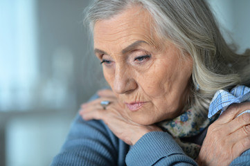 Close up portrait of sick senior woman