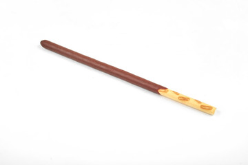 Biscuit sticks in chocolate coating on white background.