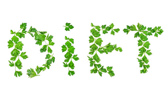 word "diet" of sprigs of parsley, greens isolated on white background. concept of diet, proper nutrition and weight loss