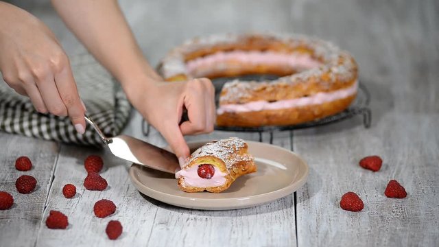 Homemade choux pastry cake Paris Brest with raspberries. French dessert.