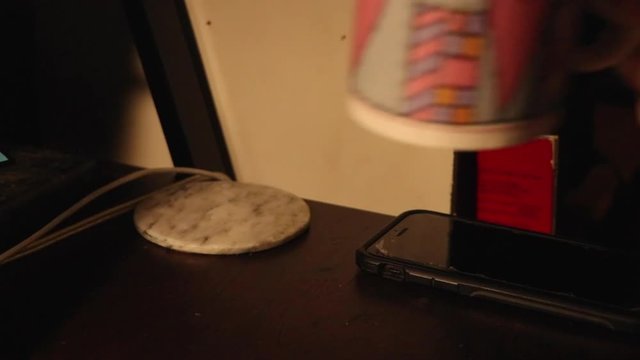 Picking up a cup then putting it back down.