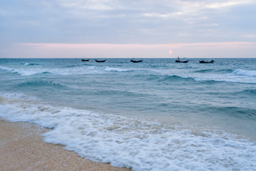 Waving boats in the sea of Weizhou Island, Beihai, Guangxi, China