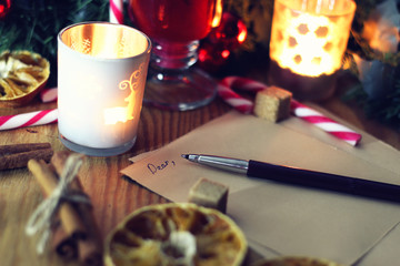Christmas letter on the table with spices