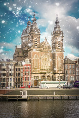 Church of St Nicholas over canal with snow, Amsterdam, Holland