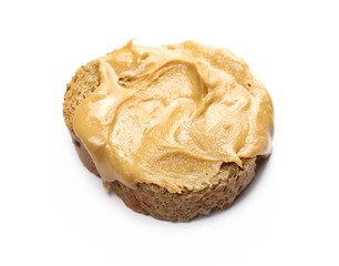 Peanut butter spread on slice of bread isolated on white background