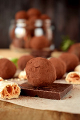 Chocolate truffles sprinkled with cocoa powder and meringues