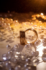 Close up photo of typical wedding rings. Lights effects