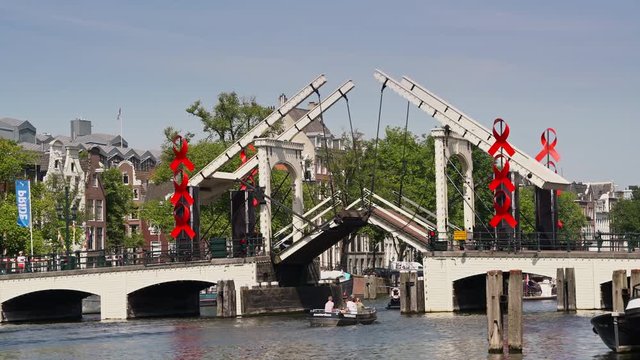 Channel &lsquo;the Amstel;&rsquo; with the famous bridge &rsquo;Magere Brug&rsquo; Amsterdam