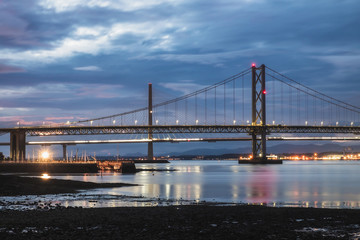 Fototapeta na wymiar Night view on two bridges, Forth Road Bridge and Queensferry Crossing