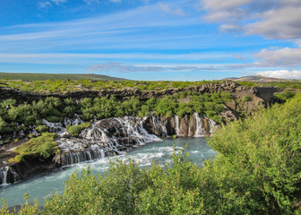 Fototapeta na wymiar Lava falls Hraunfossar run as tiny waterfalls and rapids into the Hvita River, Borgarfjordur, West Iceland, Europe