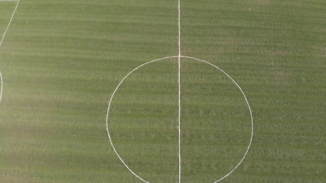Aerial footage showing playing fields and houses in the UK