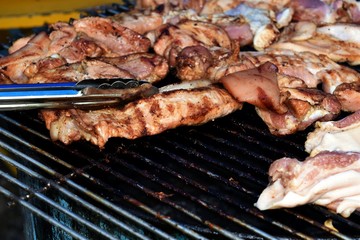 grill pork on grid in big party
