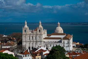 Fototapeta na wymiar Church or Monastery of Sao Vicente de Fora, Pantheom dome and Tagus river (Rio Tajo) in the background