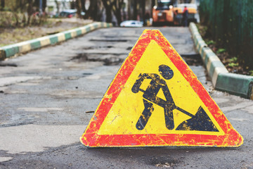 Works ahead warning sign on a road with copyspace