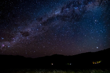 Panorama Starry night Milky way over the mountain. Abel Tasman National Park.