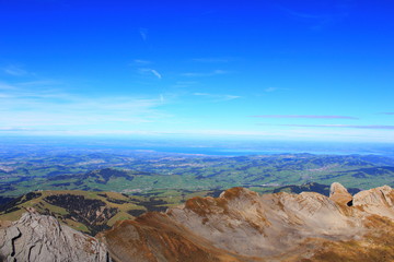 5. Tourism. Leisure. Mountain panorama. View of the adjacent mountain valley with nearby villages on a clear sunny day.