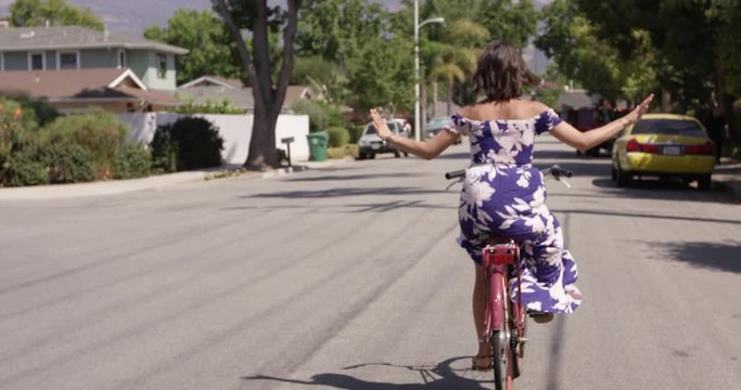 Stylish Millennial Woman Riding Bike With No Hands - Fun And Exciting