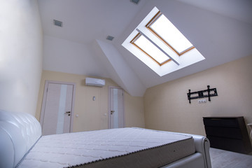 interior of an empty room with a bed