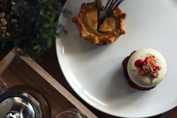 Sweet dessert strawberry cake pie and tea top view on wood backgreound