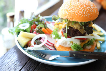 Beef hamburger fastfood on wooden table