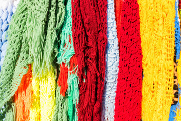 Colour knitted shawls in market close up
