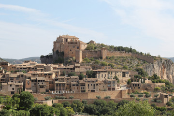 Naklejka premium A landscape, during a sunny summer, of Alquezar, a small medieval rural town with a castle monastery and a canyon in the Vero river, in Aragon, Spain