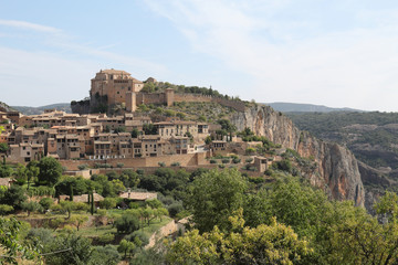 Fototapeta na wymiar A landscape, during a sunny summer, of Alquezar, a small medieval rural town with a castle monastery and a canyon in the Vero river, in Aragon, Spain