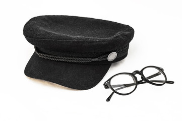 Be in trend. Woolen cap and glasses on a white background