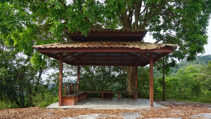 A wooden hut built by the road located in Ipoh, Perak, Malaysia.