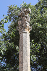 A stone made cross Calvary at the entrance of the Alquezar Colegiate abbey and castle during a...