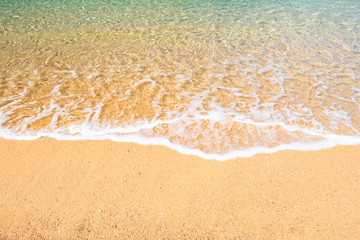 Background, Wave foam and blue ocean on the beach.