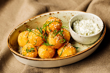 breaded cheese balls with sauce