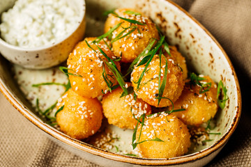 breaded cheese balls with sauce