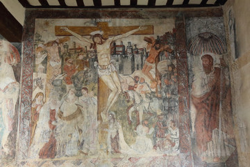 A detail of a restored medieval gothic fresco inside the Colegiata de Santa Maria la Mayor church and castle in Alquezar, Aragon region, Spain
