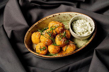 breaded cheese balls with sauce