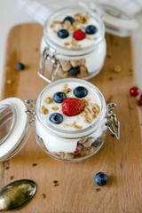 Breakfast yogurt and fresh berries. Dessert in a glass jar, bankcake