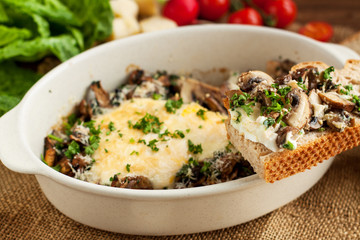 Baked eggs with mushrooms with wholemeal bread