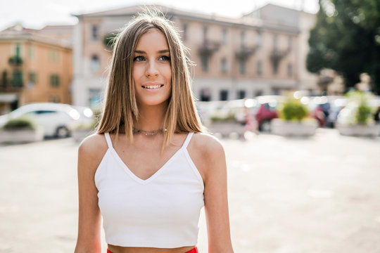 Portrait of smiling teenage girl in the city