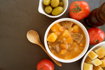 thick Hungarian soup, the goulash. on dark background.