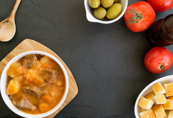 thick Hungarian soup, the goulash. on dark background.