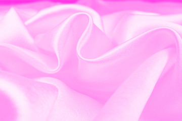 Smooth elegant pink silk or satin texture can use as abstract background. soft focus