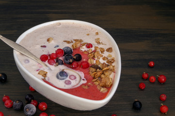Homemade healthy yogurt with black and red currants
