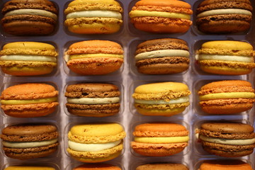 Colorful french macarons background close up