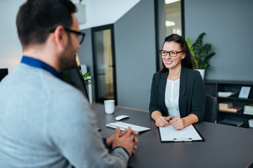 Female team leader having a meeting with her business partner.