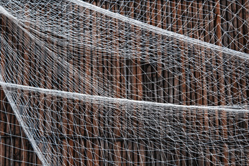 Fishing nets still-life on the wooden background.

