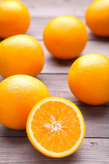 Ripe orange fruit on a grey background