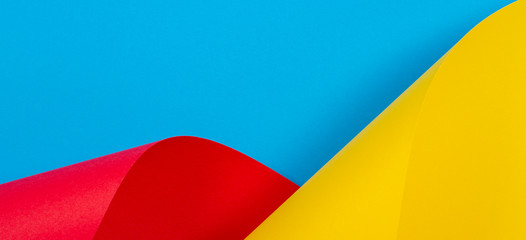 Abstract colorful background. Yellow red blue color paper in geometric shapes