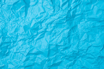 blue crumpled paper texture as background. concept of school, abstract and stress