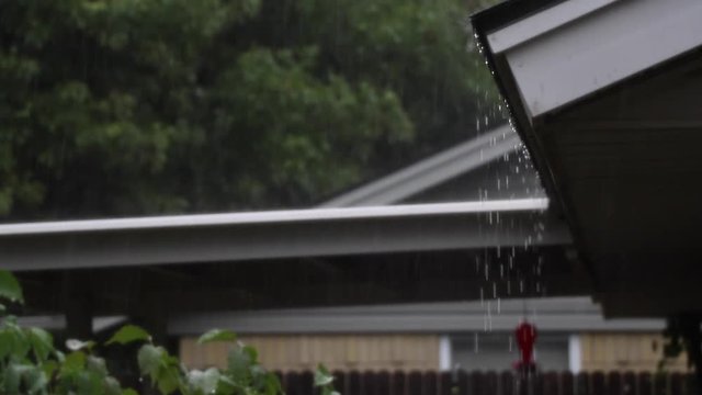 Rain dripping of a house.