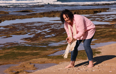 Smiling pink shells collector